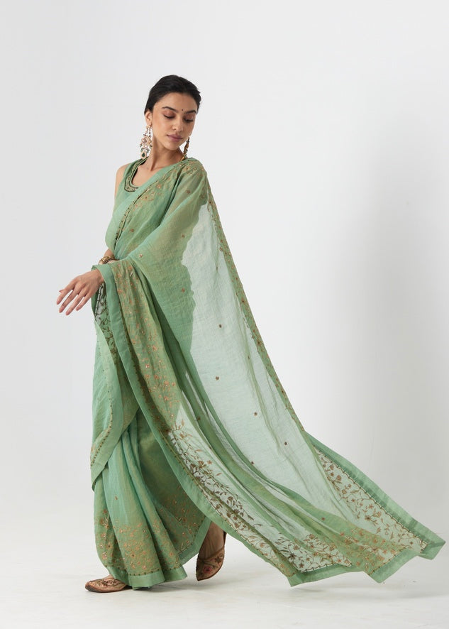 Krisha - A sage green tissue chanderi hand embroidered saree with tonal embroidered blouse