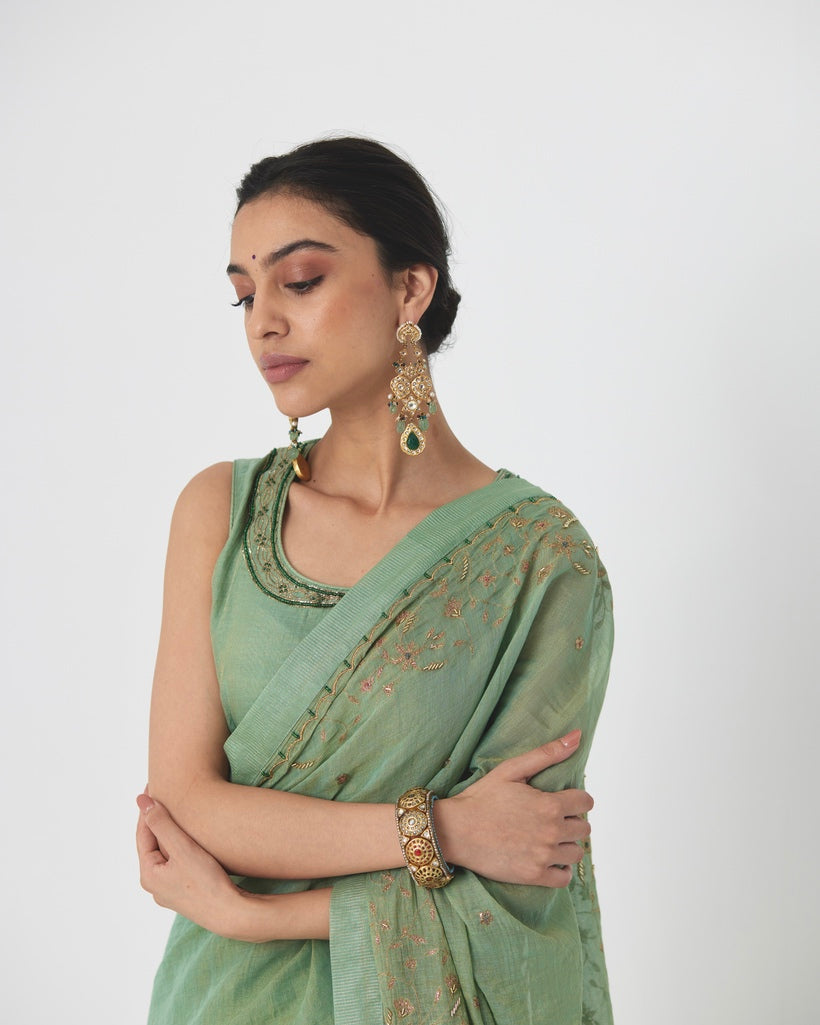 Krisha - A sage green tissue chanderi hand embroidered saree with tonal embroidered blouse