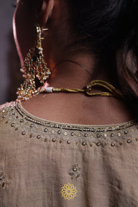 Nayani - Soft gold tissue chanderi kurta with chanderi silk blouse and benarasi silk tissue sharara paired with pink tissue chanderi dupatta in handcrafted in ari-zardozi embroidery