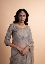 Load image into Gallery viewer, Kriya - Tissue Chanderi and Organza Mukaish Saree, Adorned with Handcrafted Ari-Zardozi Embroidery, Complemented by a Jam Cotton Petticoat and Chanderi Blouse
