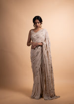 Load image into Gallery viewer, Kritika - Almond Chiffon Saree with a Satin Modal Blouse, Lined with Soft Cotton and Adorned with Handcrafted Ari-Zardozi Embroidery
