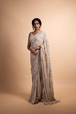 Load image into Gallery viewer, Kritika - Almond Chiffon Saree with a Satin Modal Blouse, Lined with Soft Cotton and Adorned with Handcrafted Ari-Zardozi Embroidery
