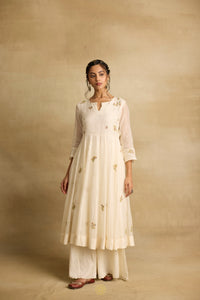 Asin - An ivroy white mul chanderi anarkali with sharara paired with a kota silk dupatta, handcrafted ari and zardosi embroidery