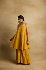 Load image into Gallery viewer, Freya – Golden yellow tissue chanderi strapped kurta and sharara paired with kota silk dupatta, hand crafted ari and zardozi embroidery
