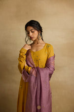 Load image into Gallery viewer, Meher – Golden yellow tissue chanderi Anarkali sharara set paired with mauve kota silk dupatta, handcrafted ari and zardozi embroidery
