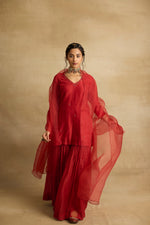 Load image into Gallery viewer, Tiya – A rust red chanderi silk sharara set, organza dupatta, handcrafted ari zardozi work
