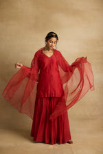 Load image into Gallery viewer, Tiya – A rust red chanderi silk sharara set, organza dupatta, handcrafted ari zardozi work
