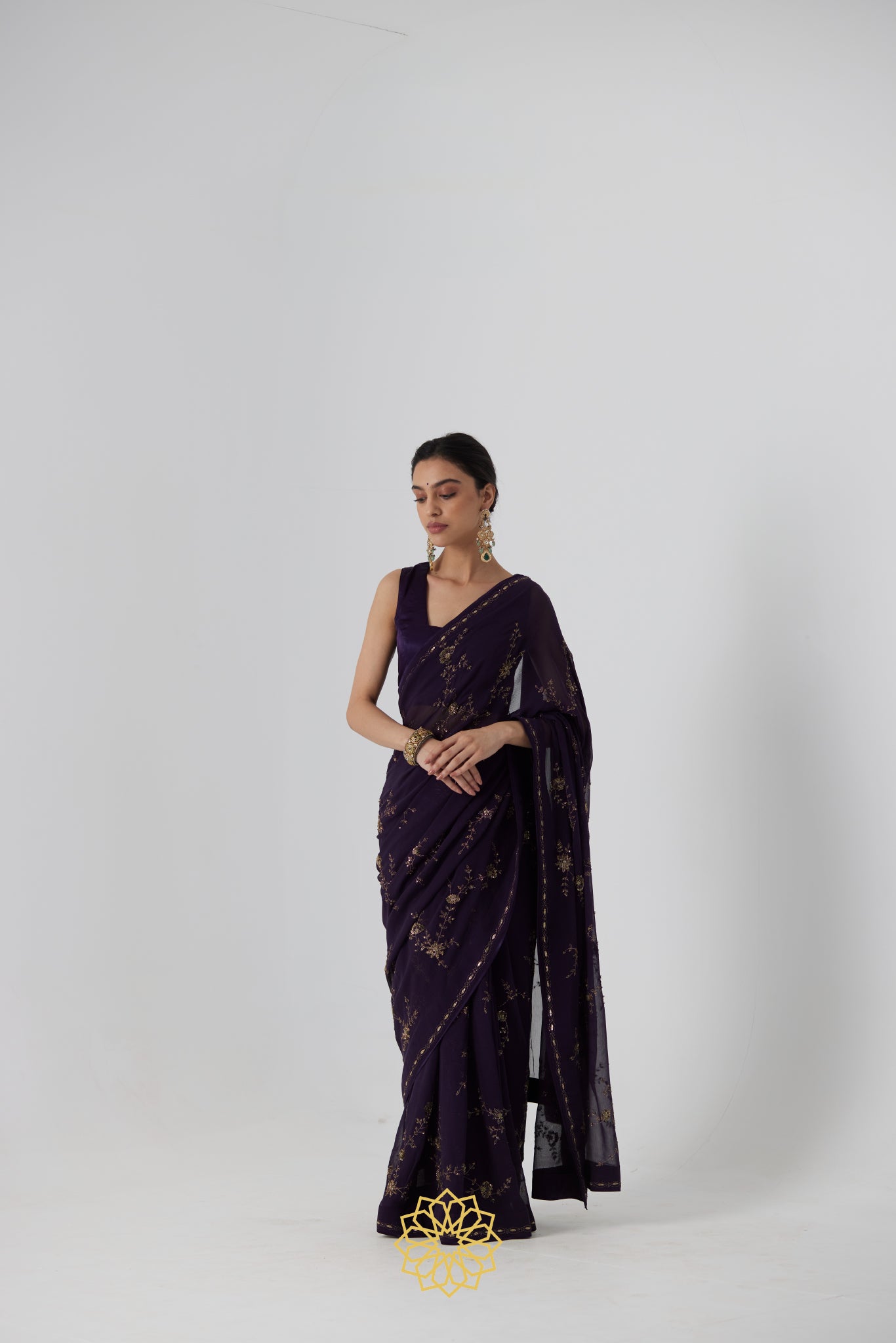 Yutika - An aubergine chiffon hand embroidered chiffon saree with tonal satin silk blouse