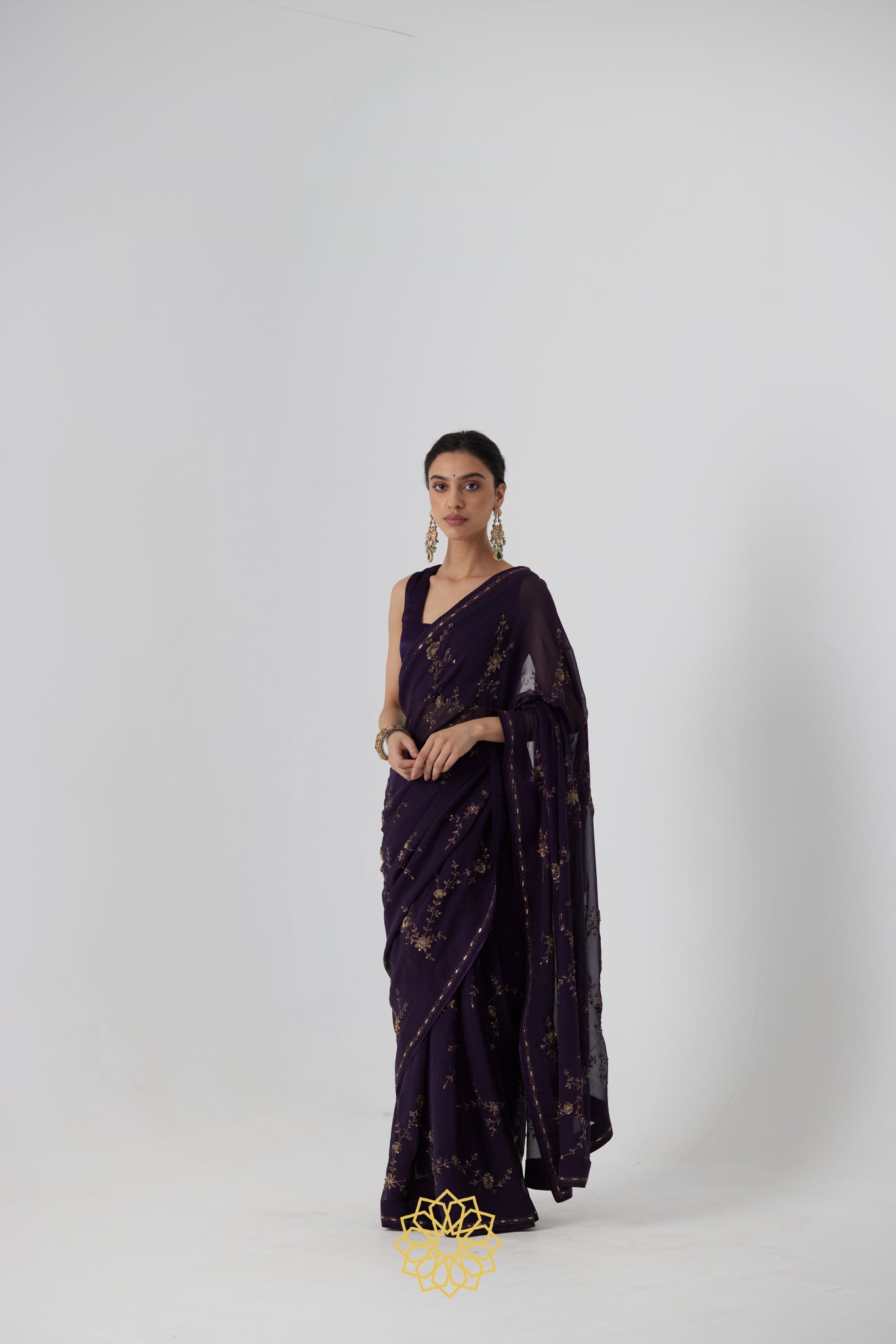 Yutika - An aubergine chiffon hand embroidered chiffon saree with tonal satin silk blouse