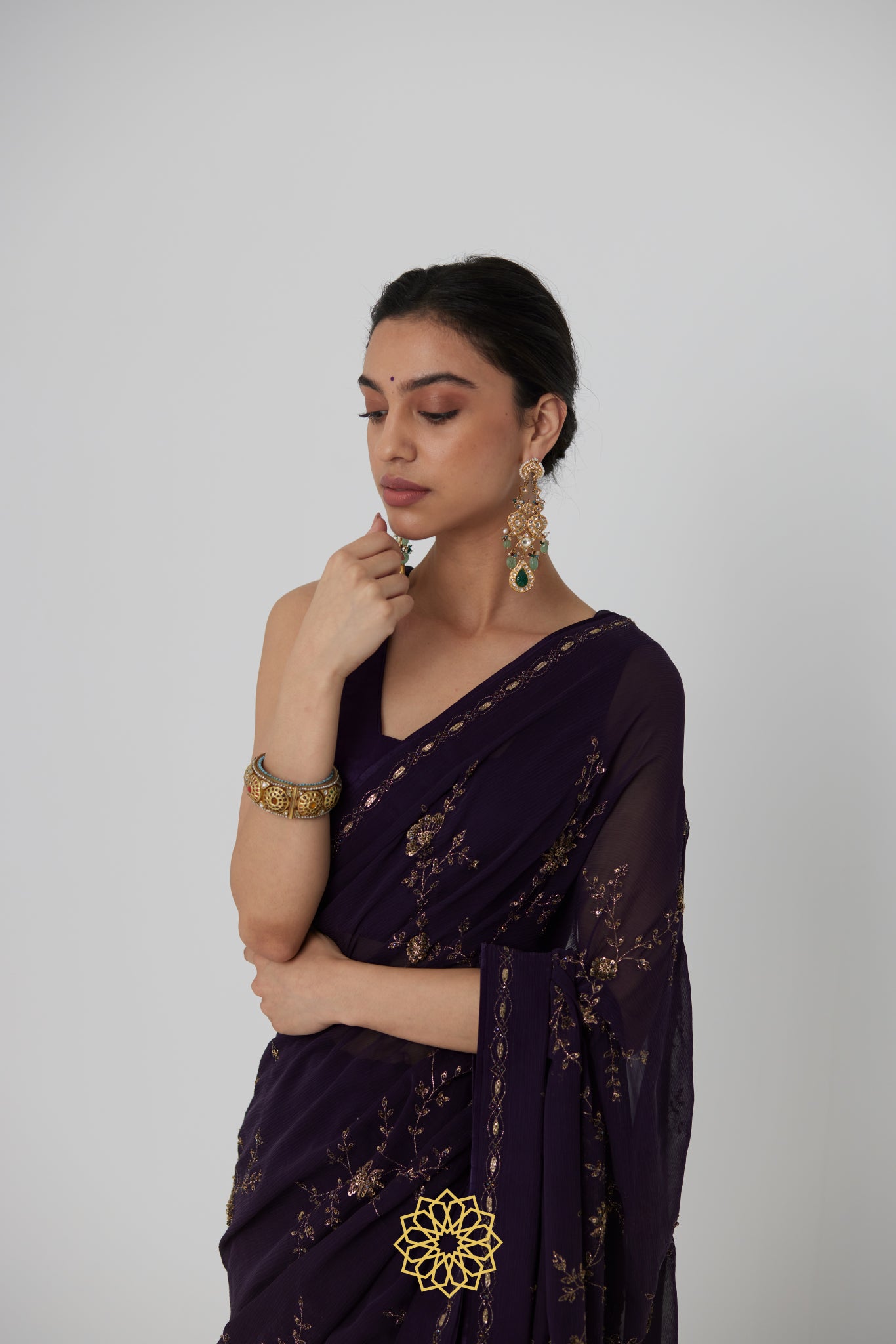 Yutika - An aubergine chiffon hand embroidered chiffon saree with tonal satin silk blouse